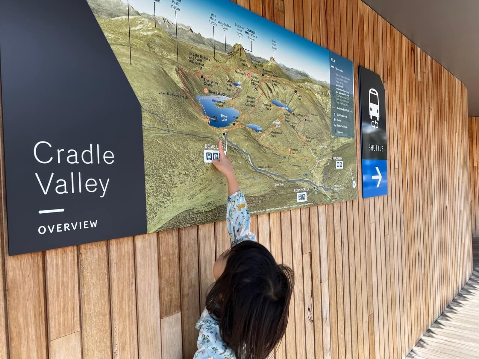 Sophie pointing at the Cradle Valley map