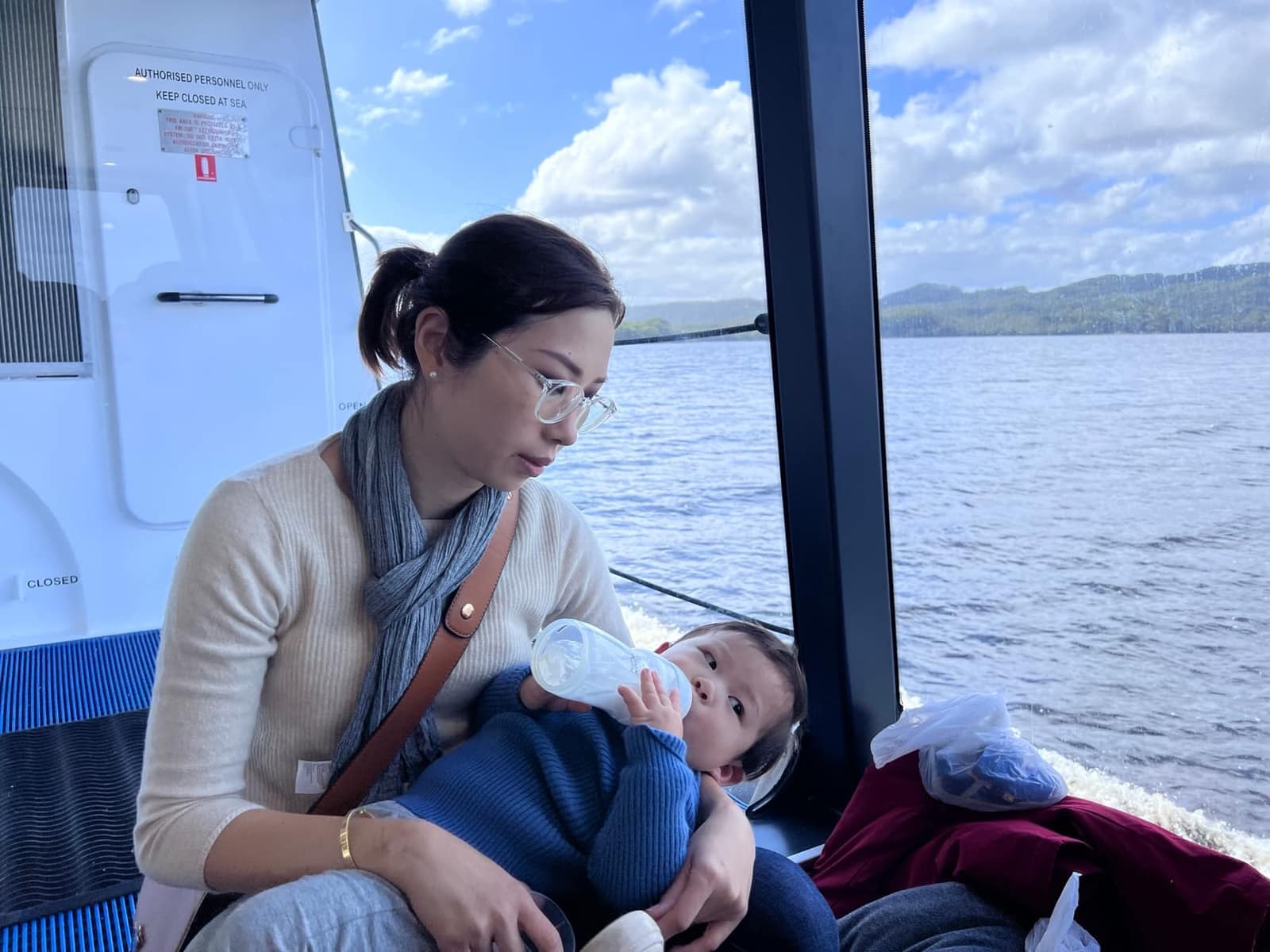 Vanessa feeding George on the Gordon River boat