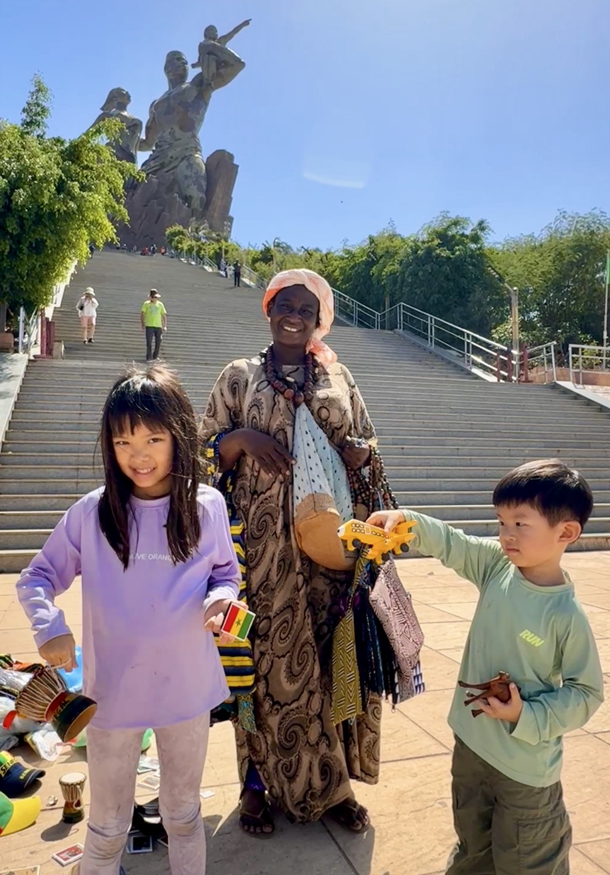 The children at a monument in Dakar