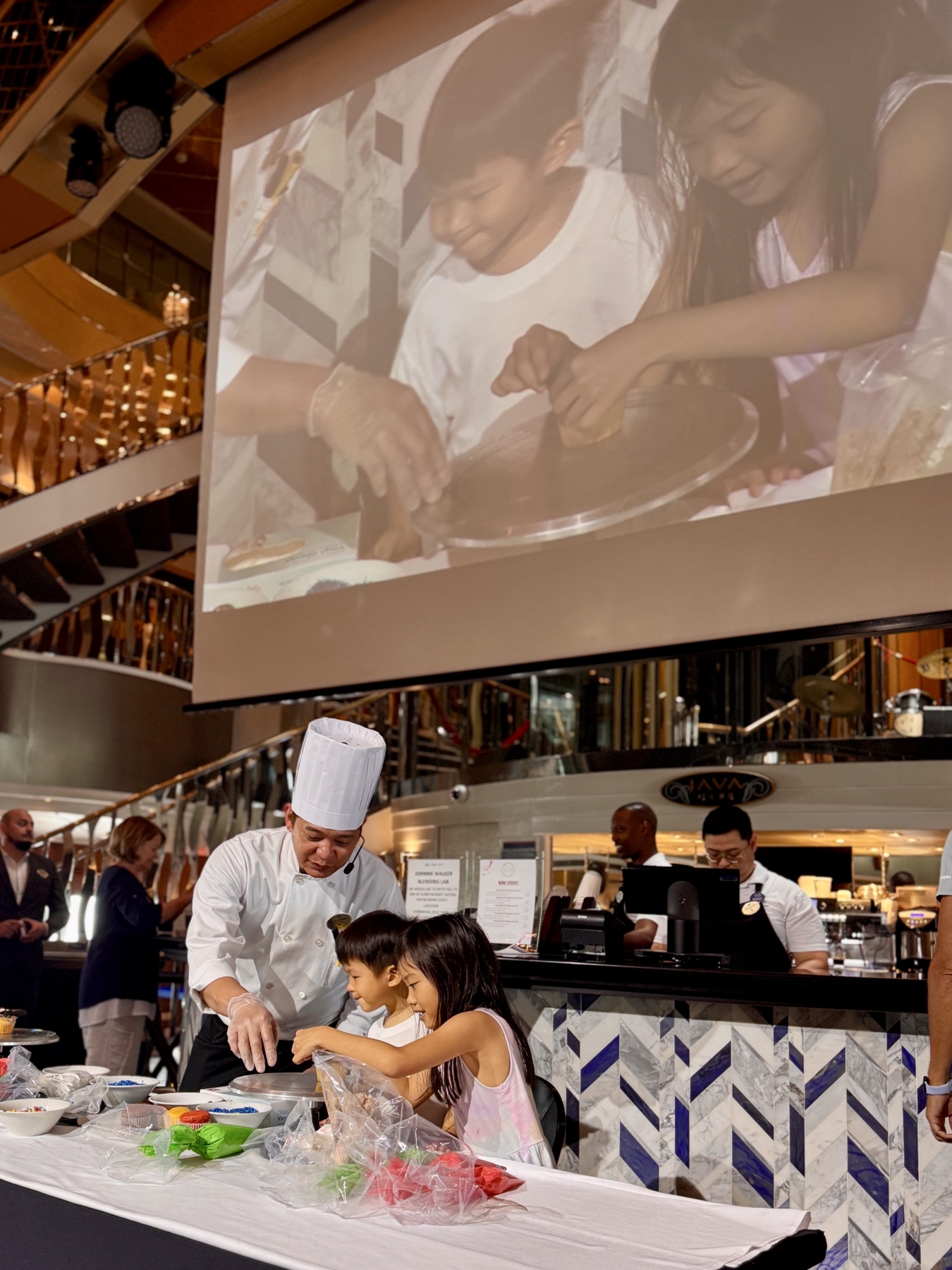 The children joining a cooking demonstration