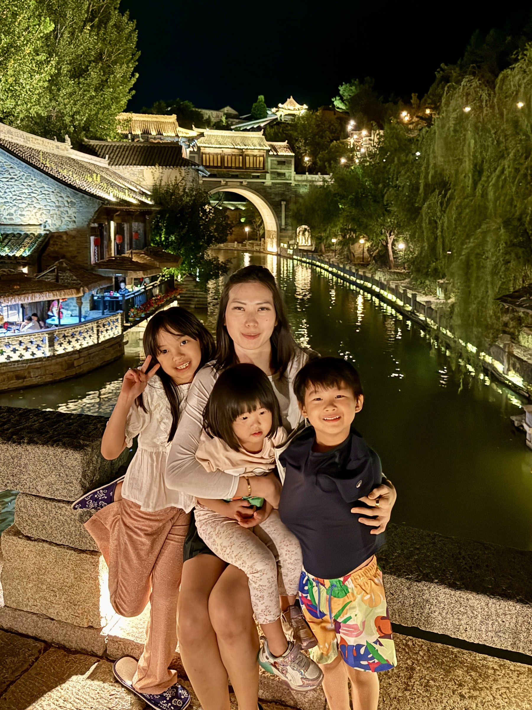 My wife and the children in Gubei Water Town at night