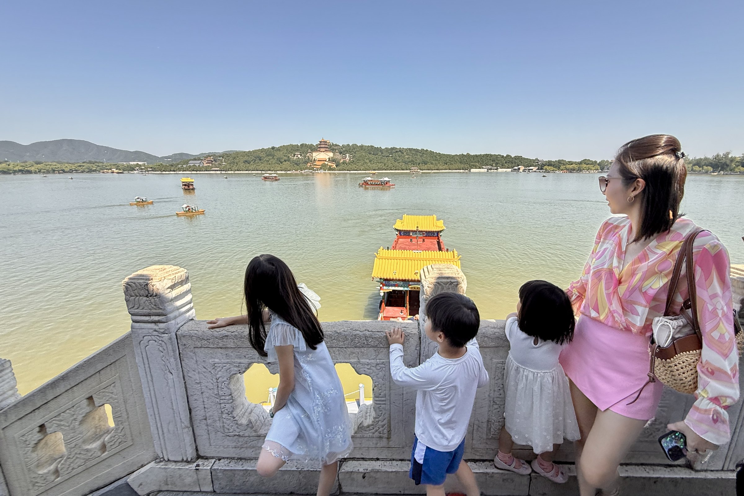 The family overlooking the lake at the Summer Palace