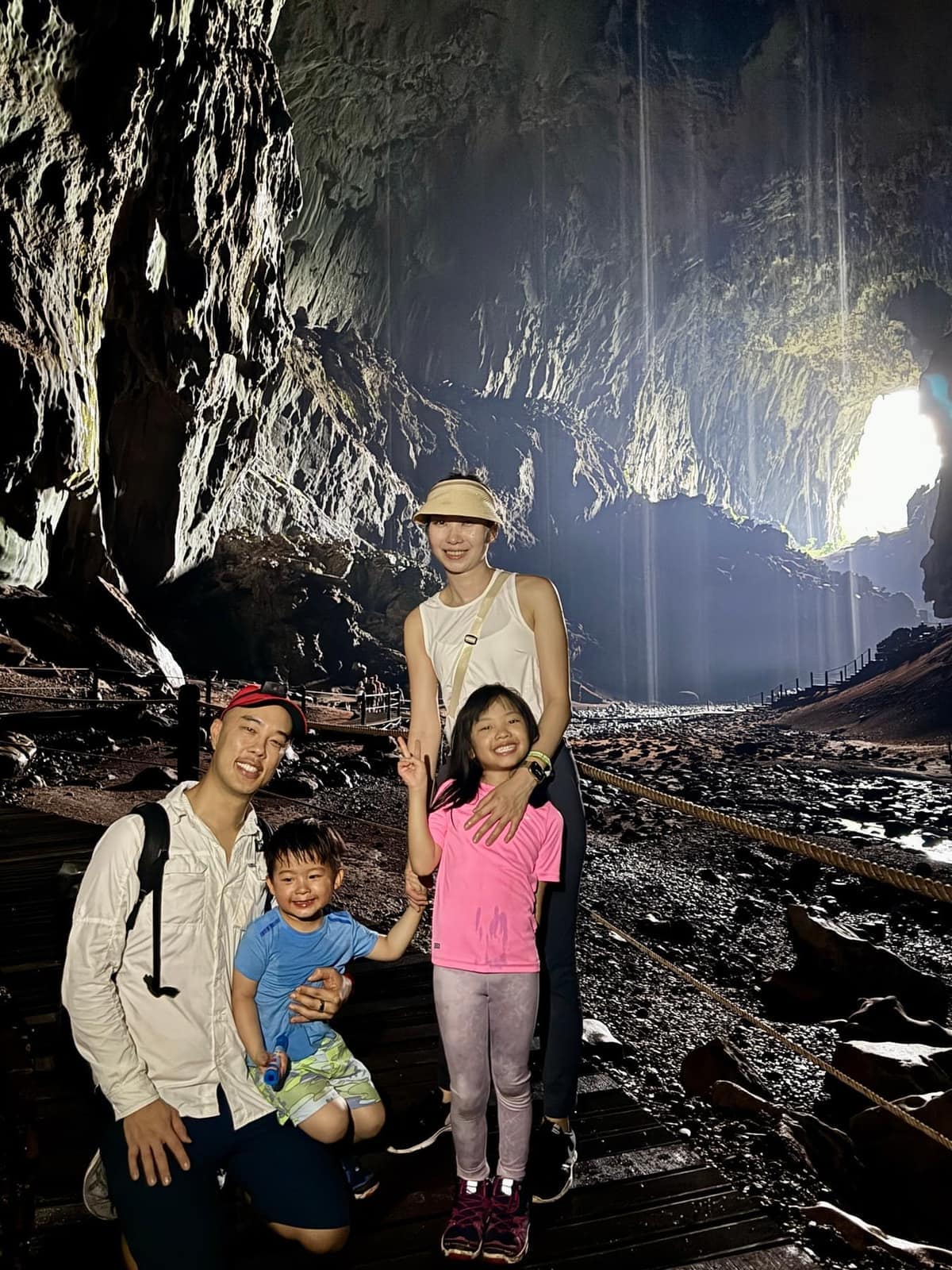 The family together inside the enormous chamber of Deer Cave