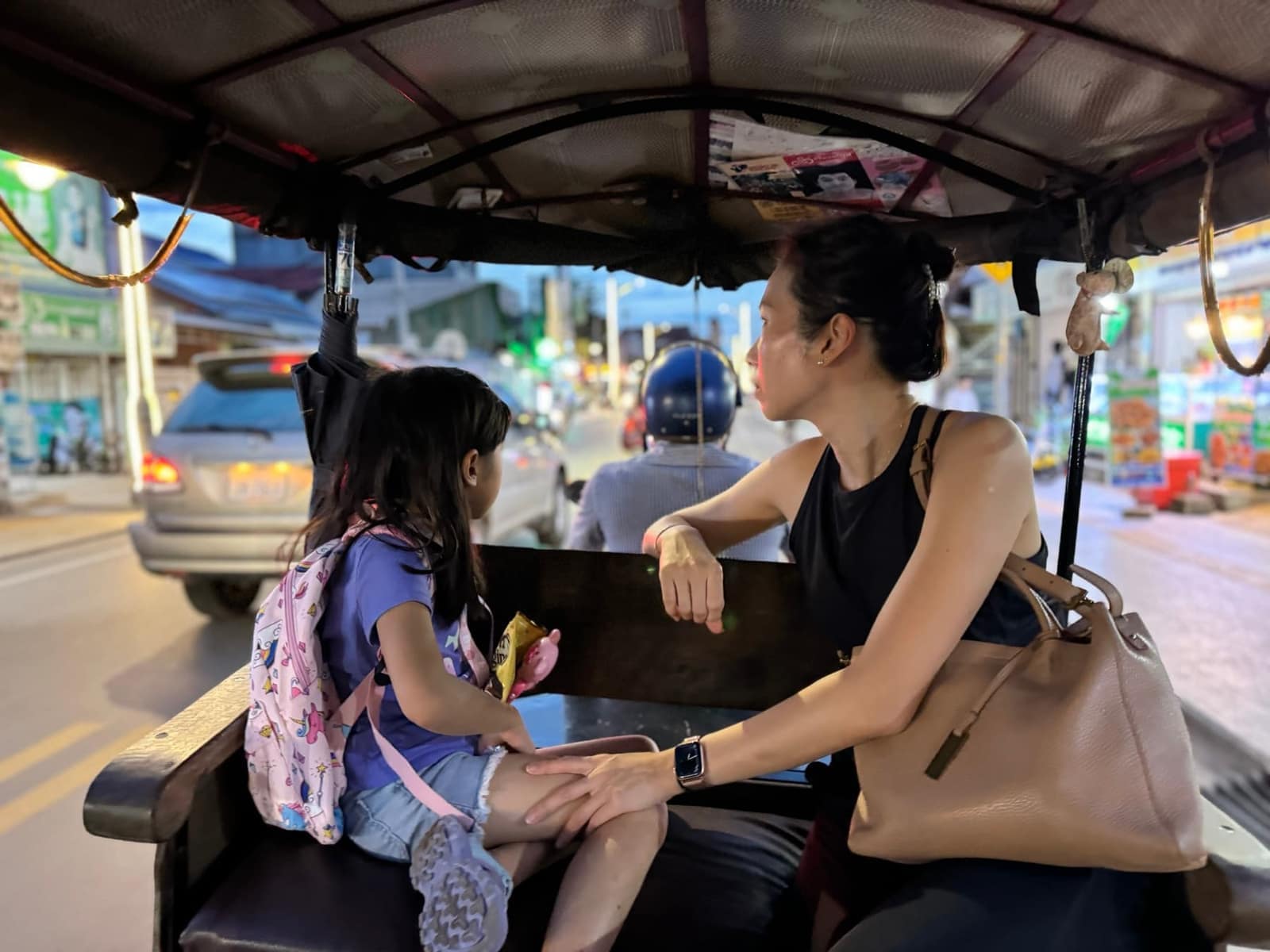 Vanessa and Sophie riding through Siem Reap by tuk-tuk