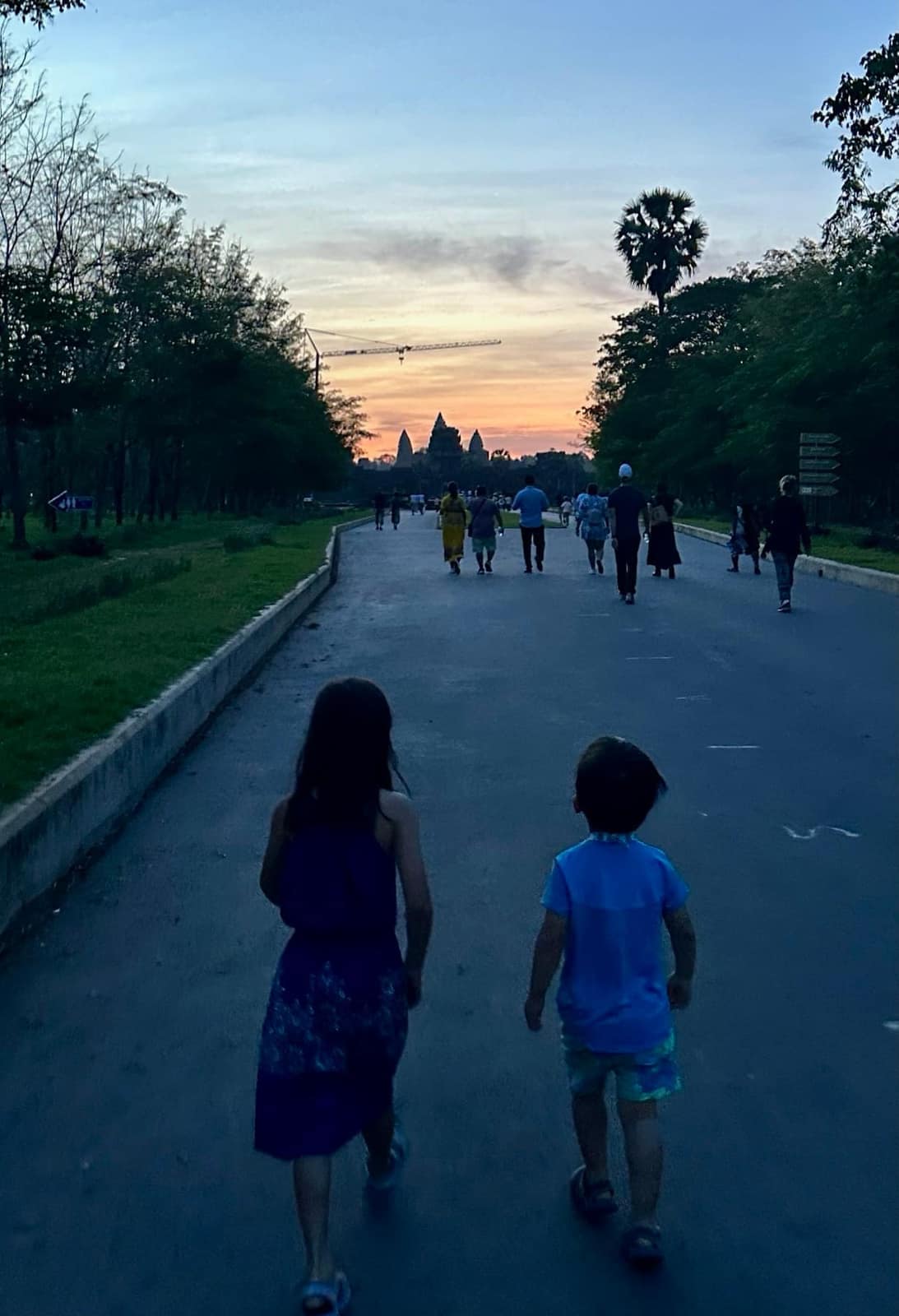 Sophie and George walking towards Angkor Wat before sunrise