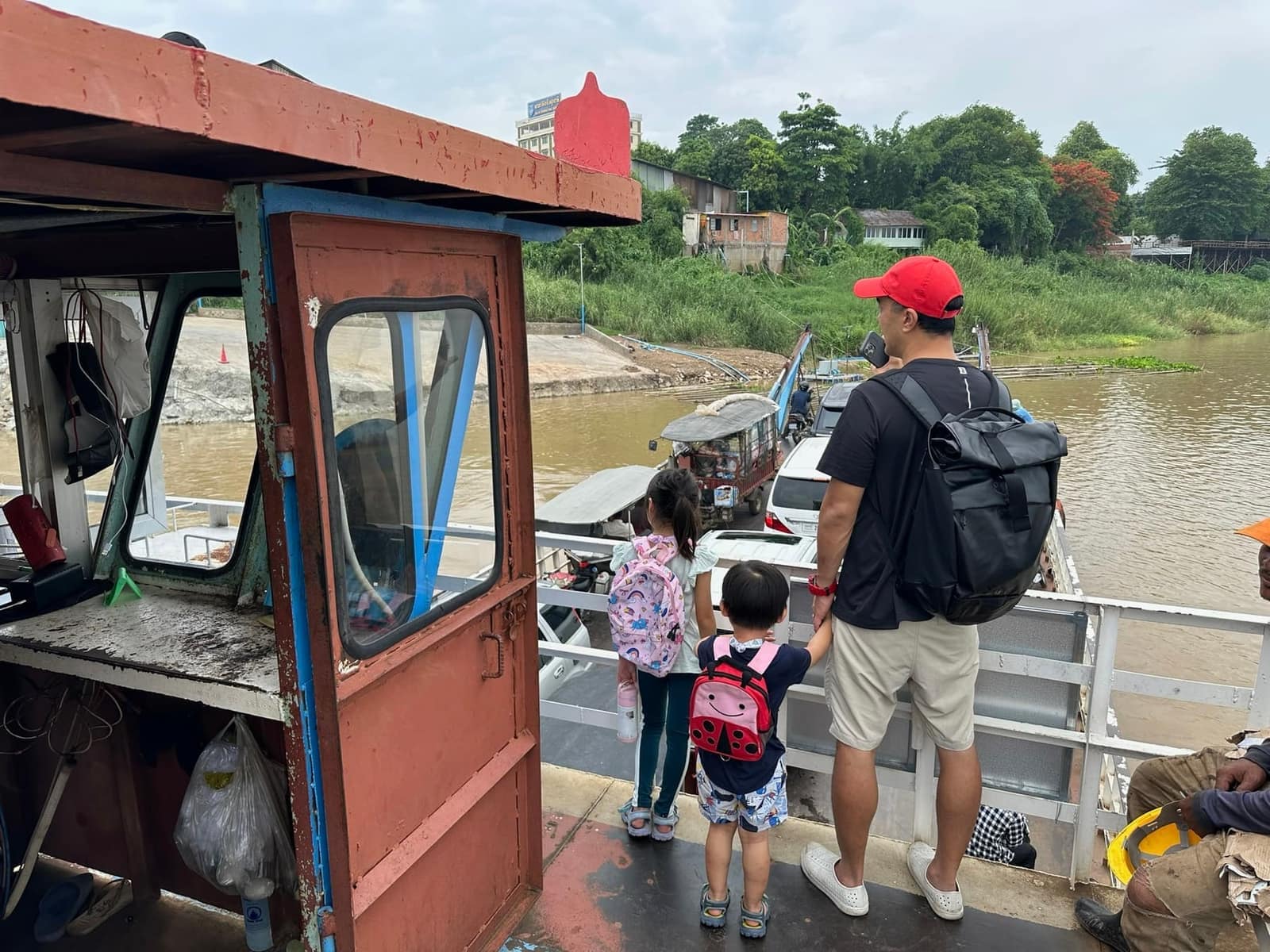 Philip, Sophie and George boarding the local vehicle ferry across the Mekong to Koh Dach
