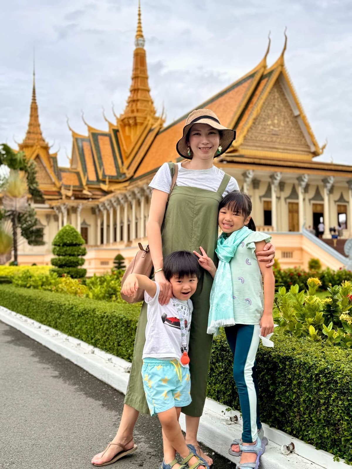 Vanessa, Sophie and George standing in the Royal Palace grounds in Phnom Penh