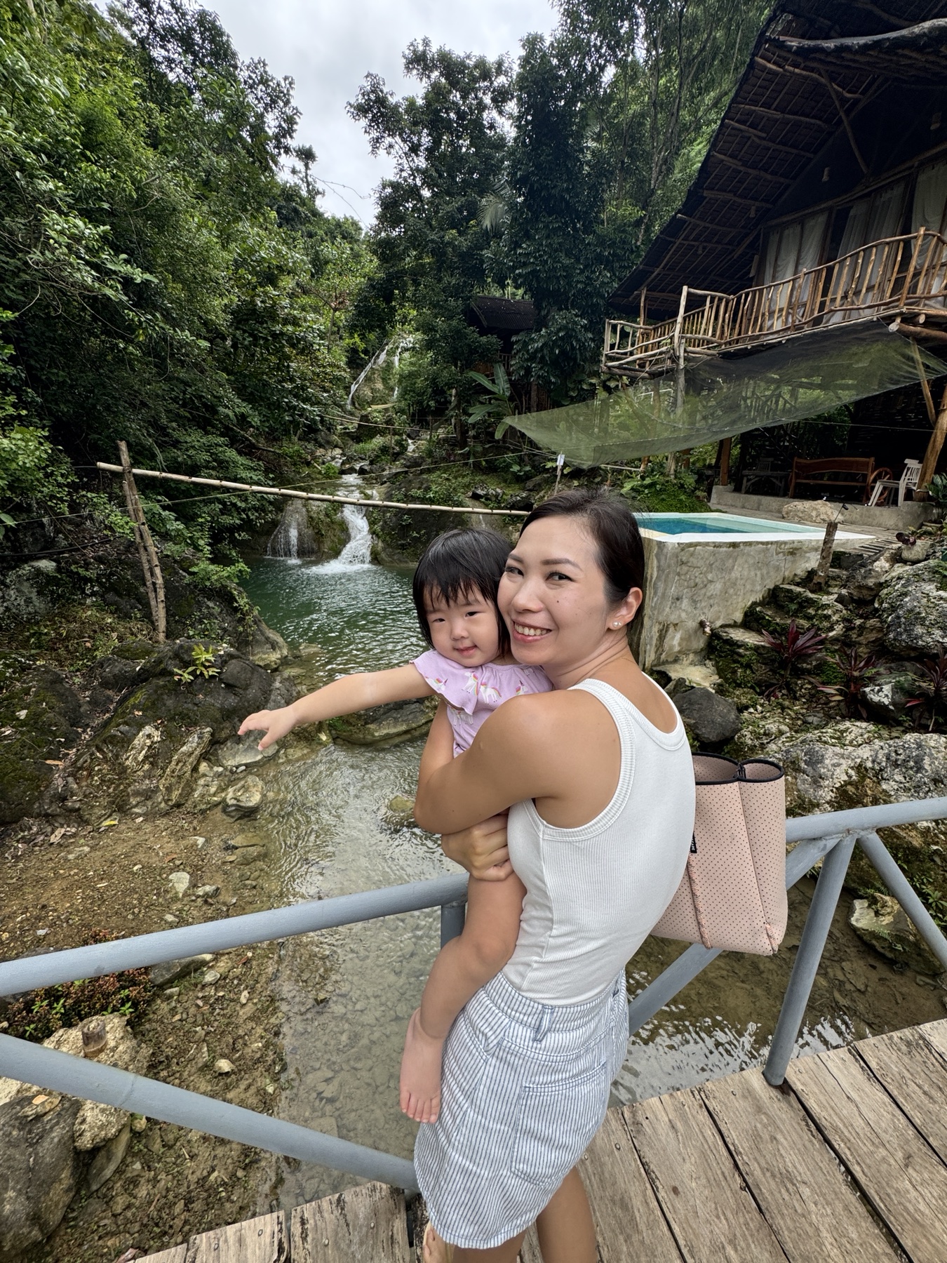 Vanessa holding Claire above the stream on the final morning in southern Cebu