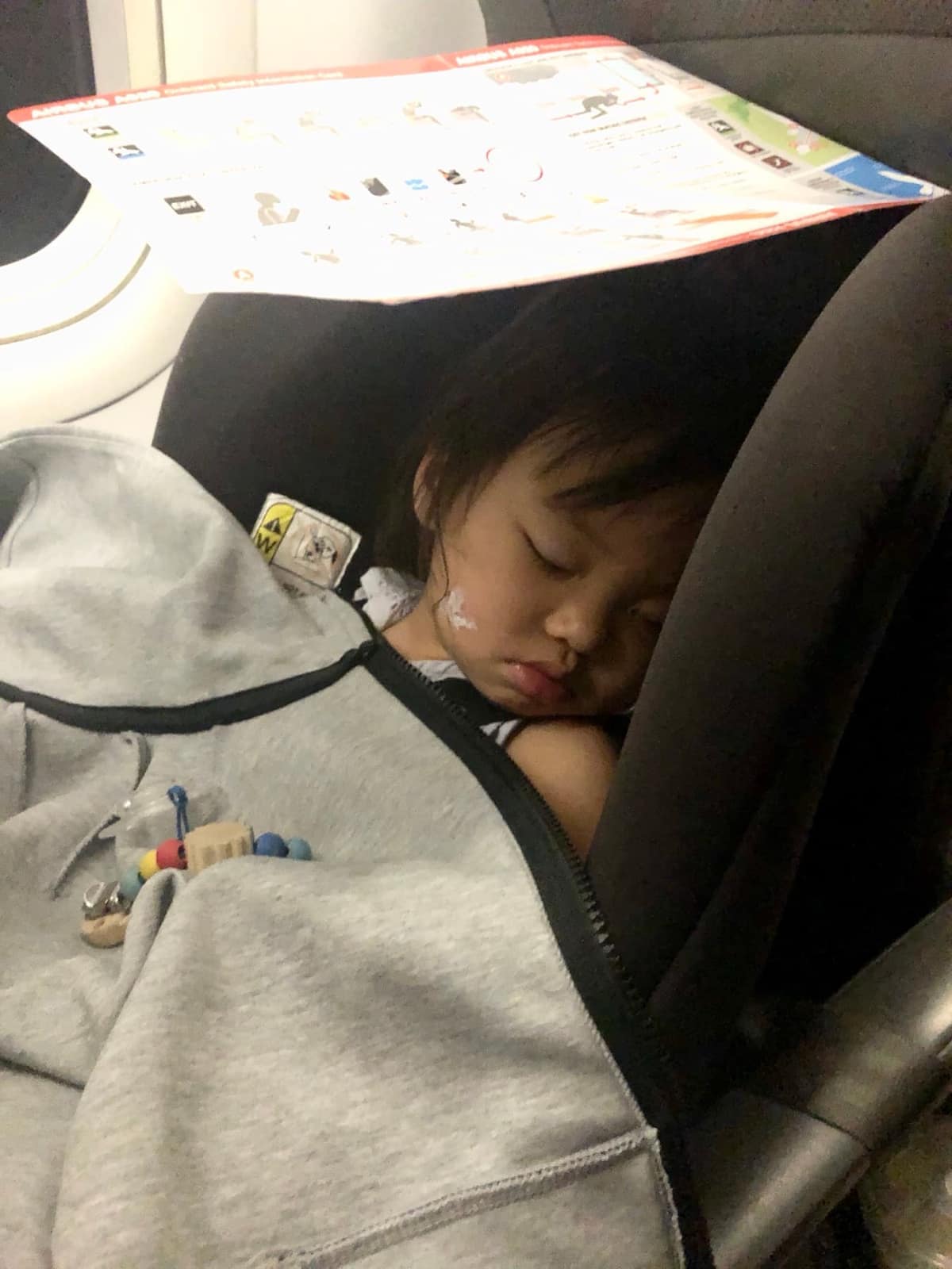 Sophie asleep in her seat on the journey home