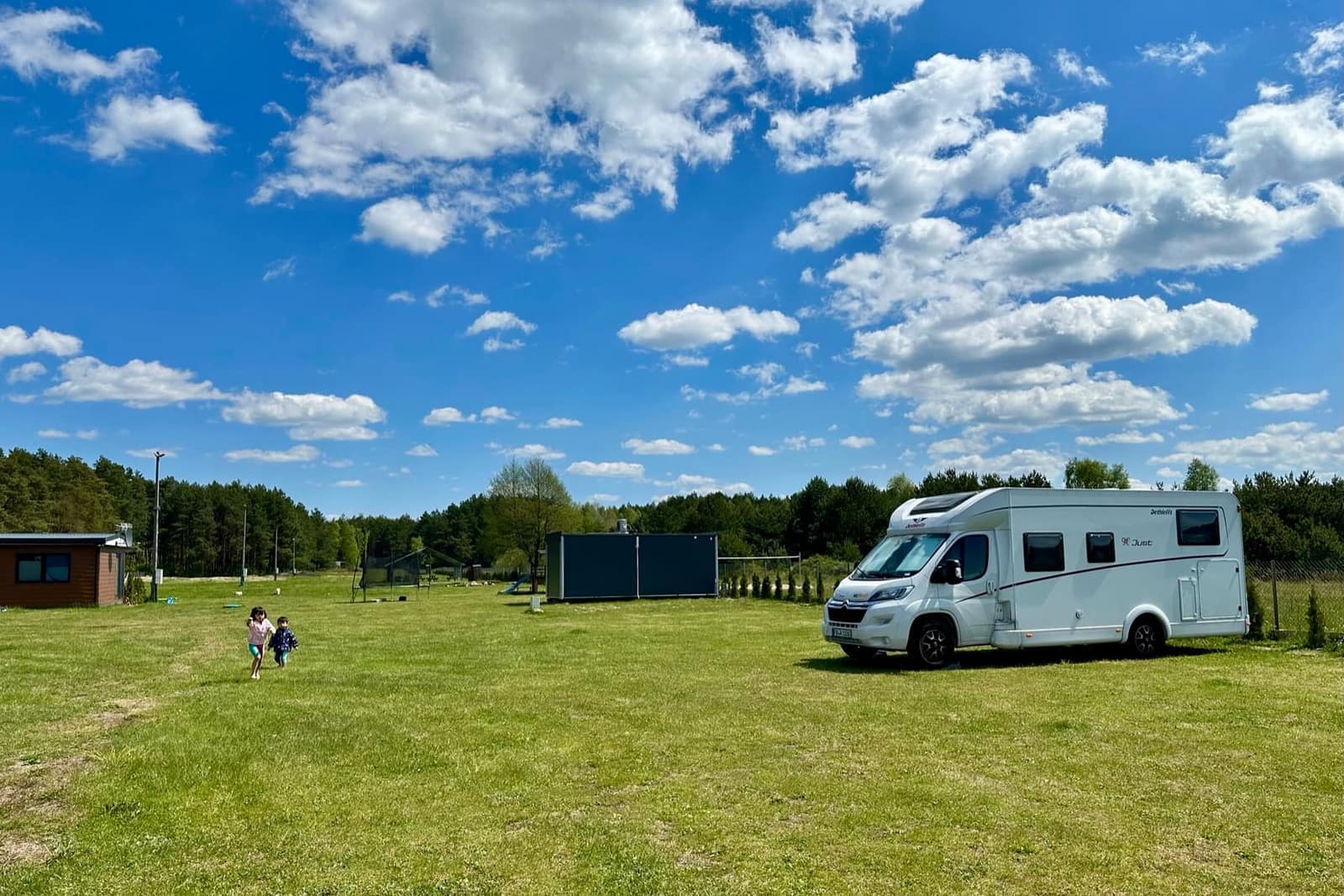The motorhome alone in a large campsite field