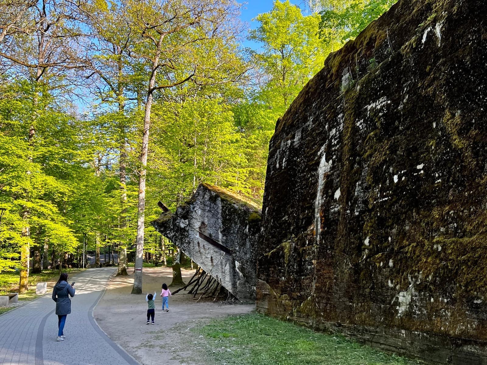 The children walking beside a bunker at Hitler's Wolf's Lair in Poland