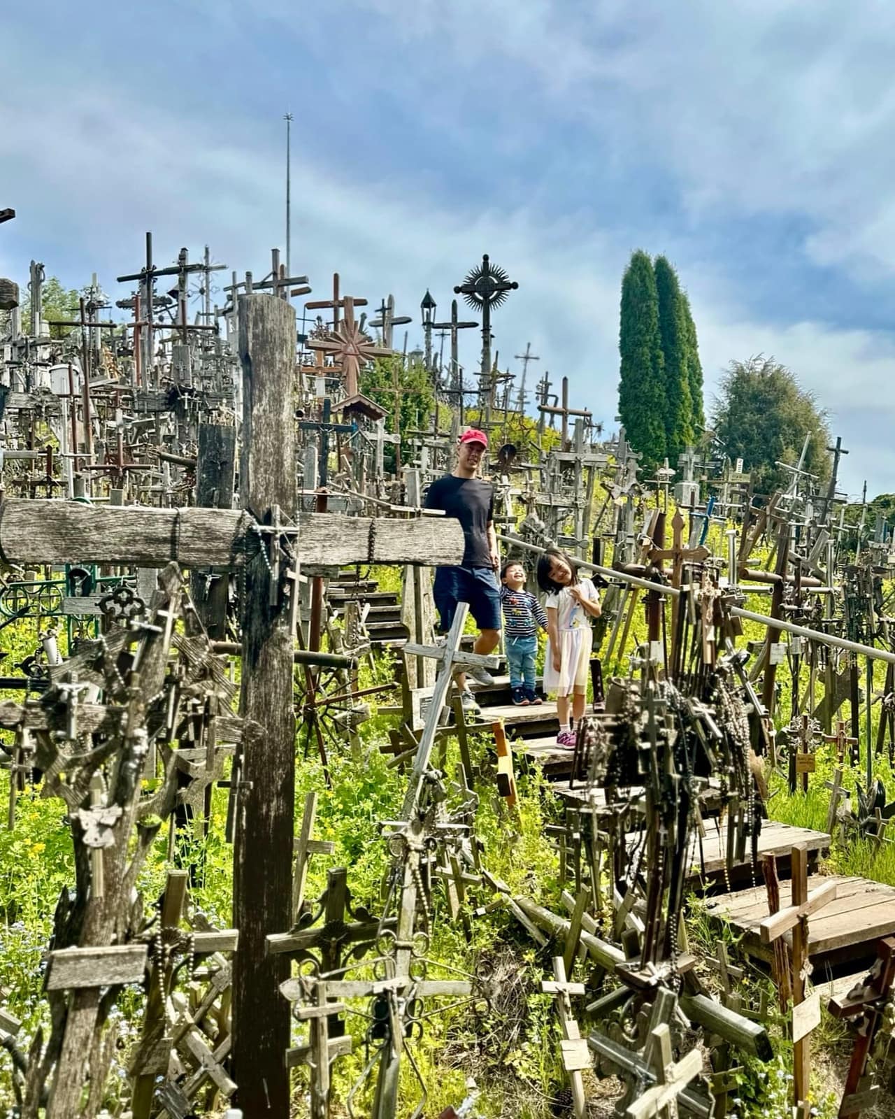 The children walking through the Hill of Crosses in Lithuania