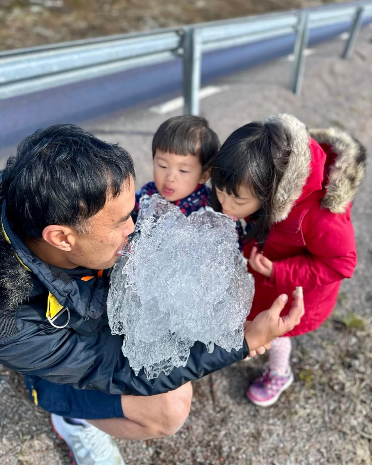 The children licking a piece of river ice in Sweden
