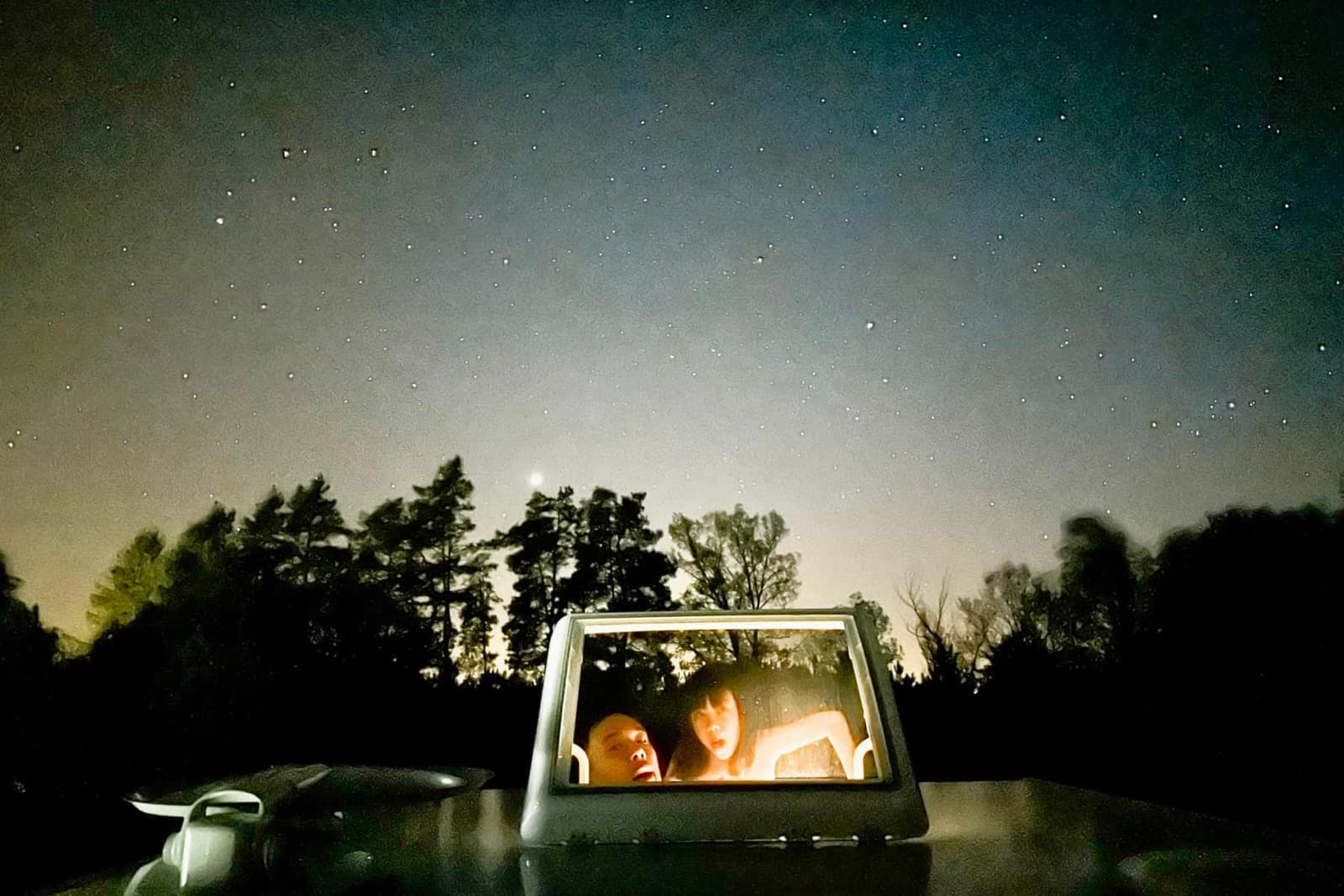 A dark road seen through the motorhome windscreen at night