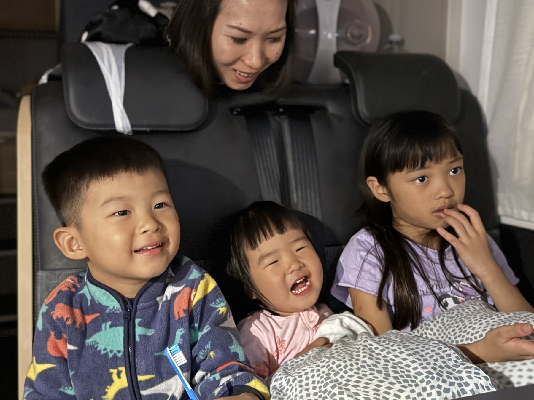 The children having movie night inside the motorhome