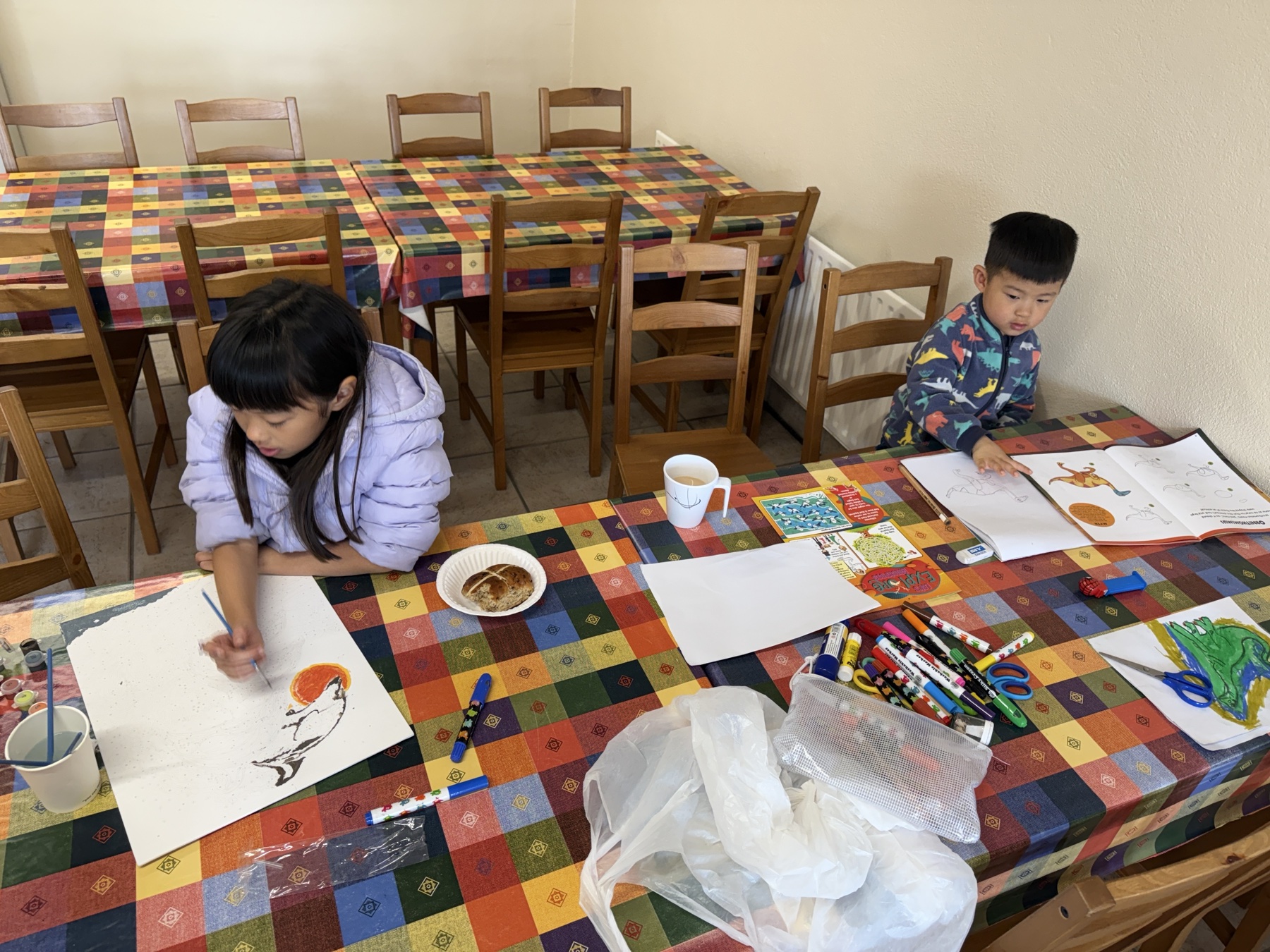 The children doing arts and crafts at a campsite
