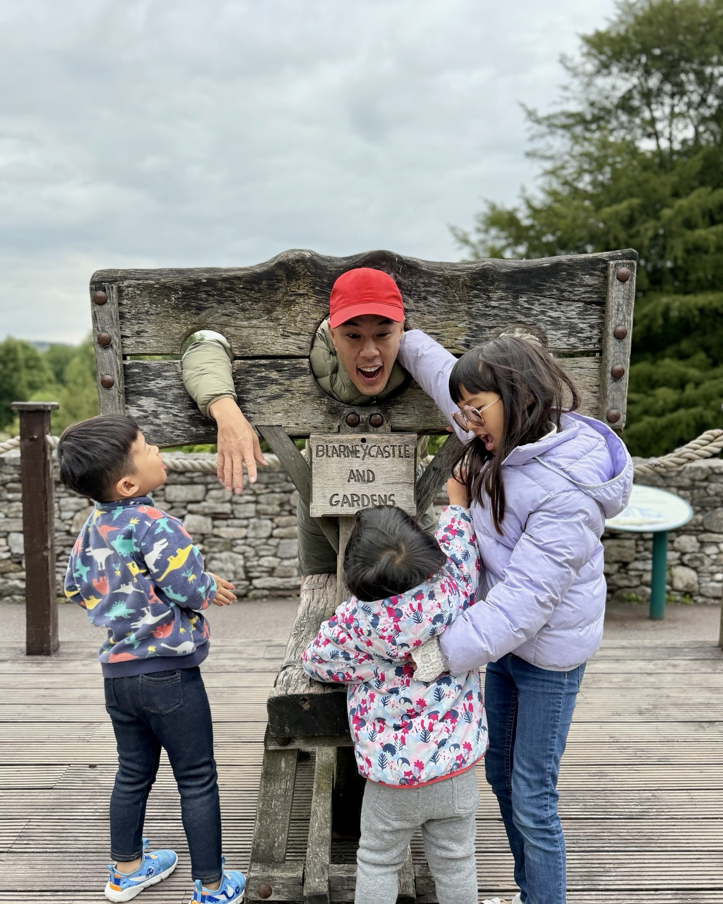 The children playing around Philip at Blarney Castle