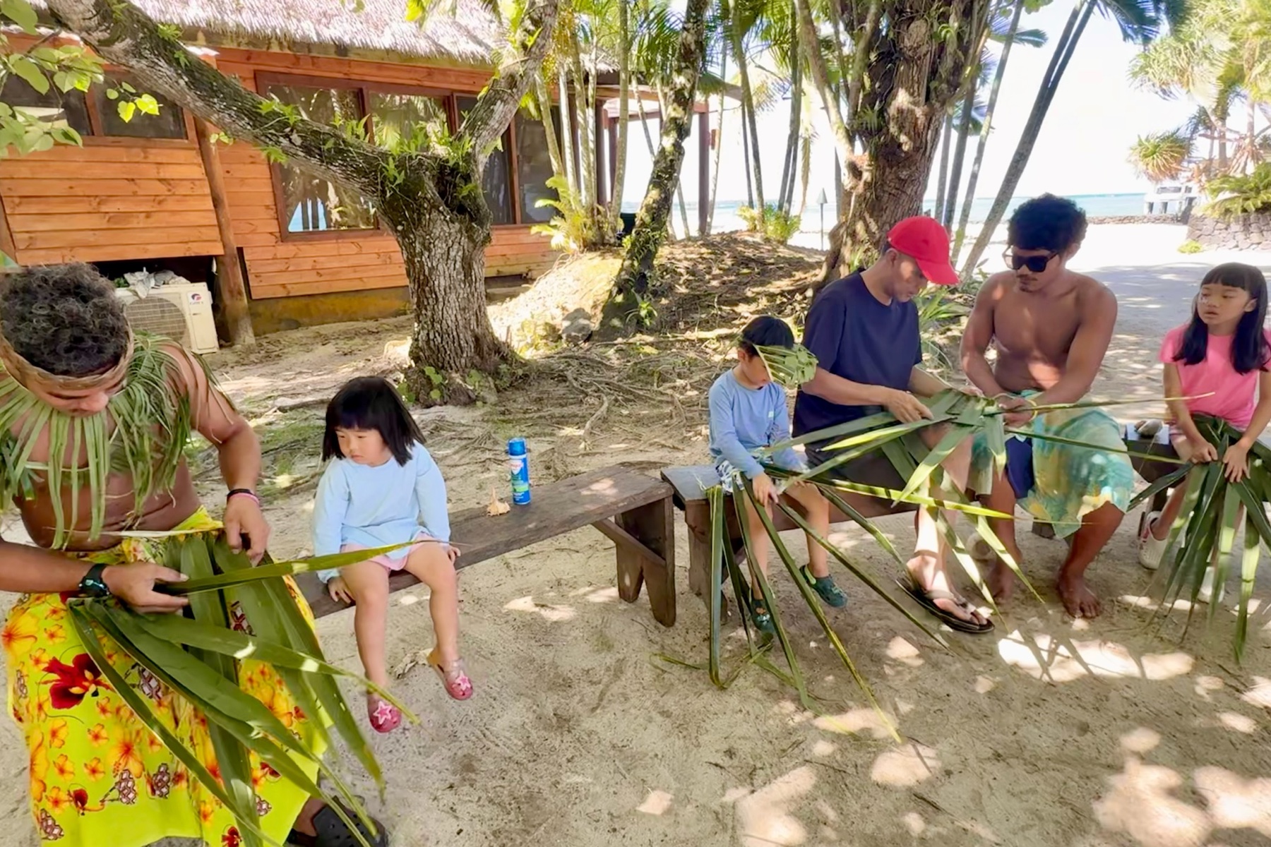 Children weaving their own plates while learning local cooking