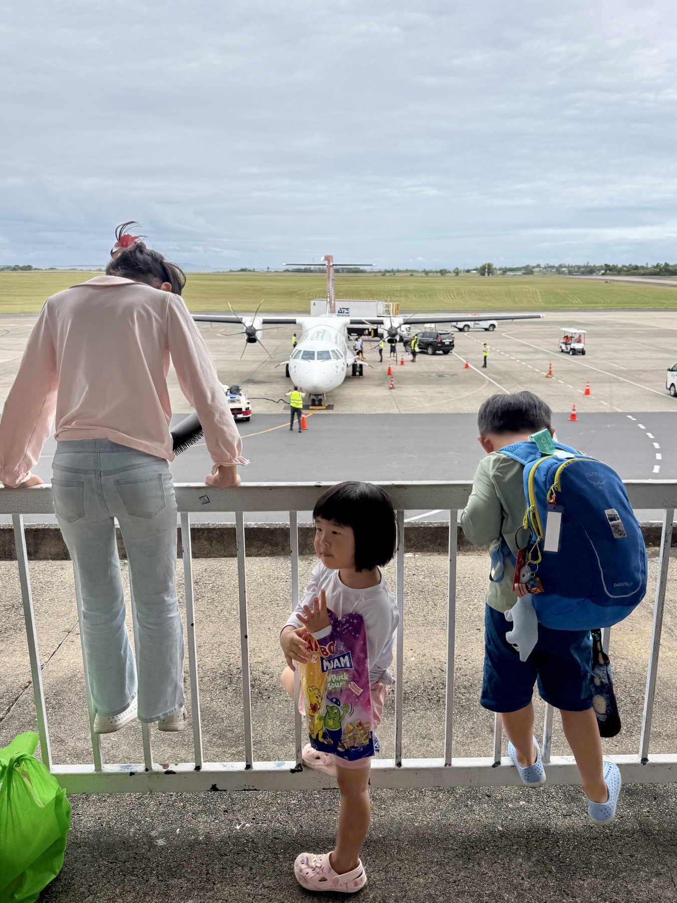 Family boarding the flight to Tuvalu