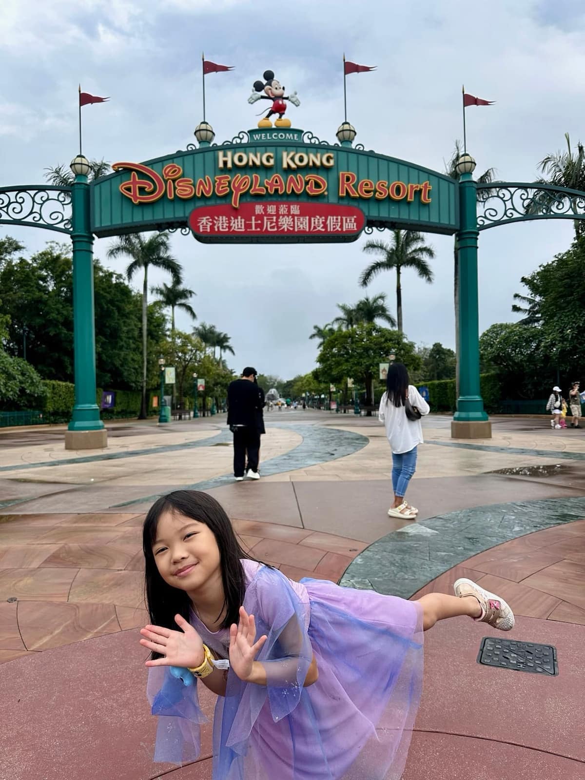 Sophie at the entrance to Hong Kong Disneyland Resort