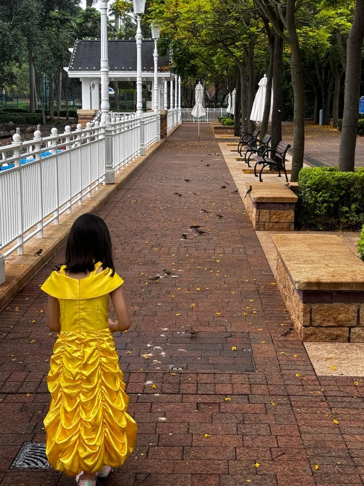 Sophie walking beside the lake at Hong Kong Disneyland Resort