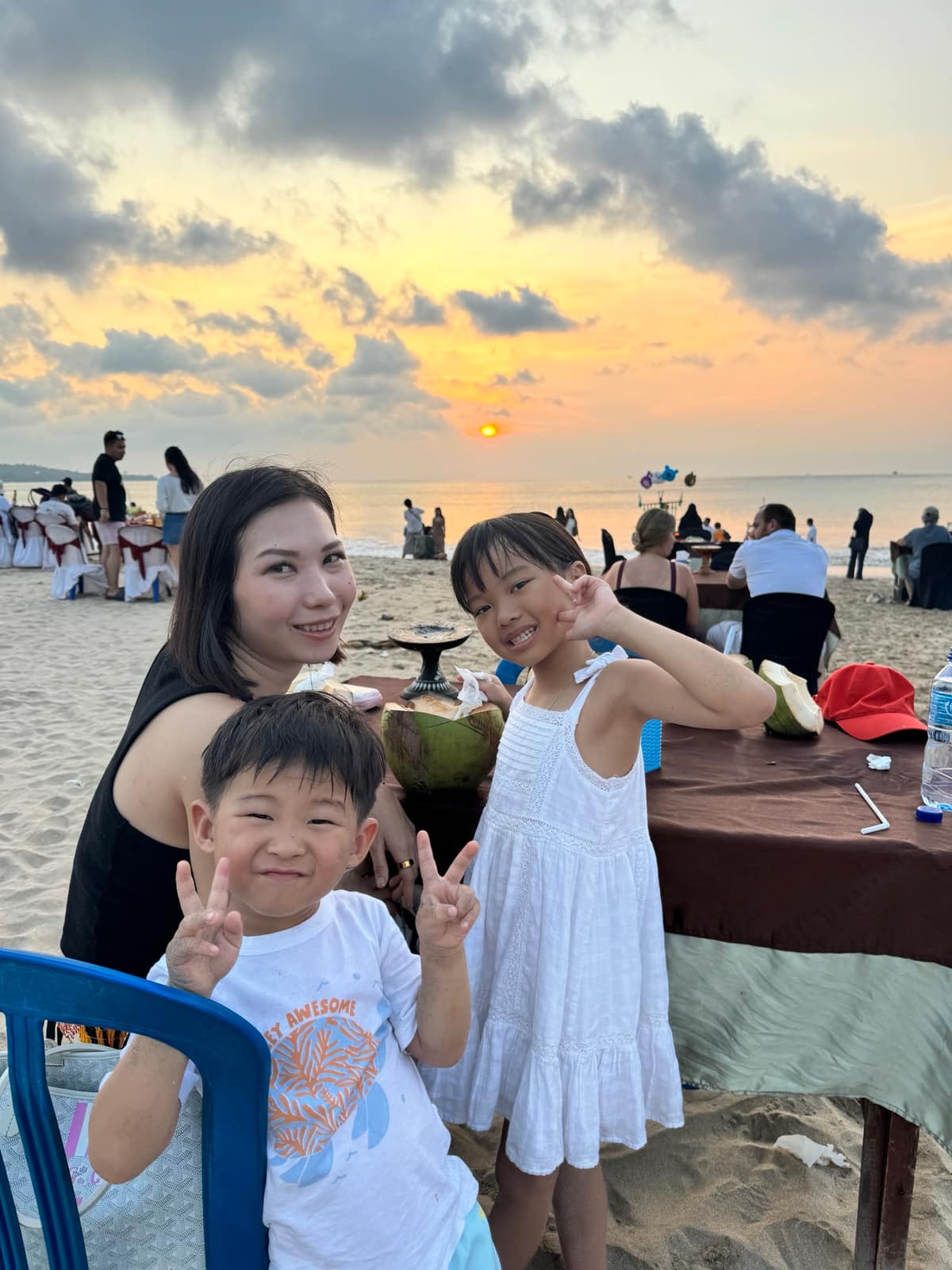 Vanessa, Sophie and George at dinner beside Kedonganan Beach at sunset