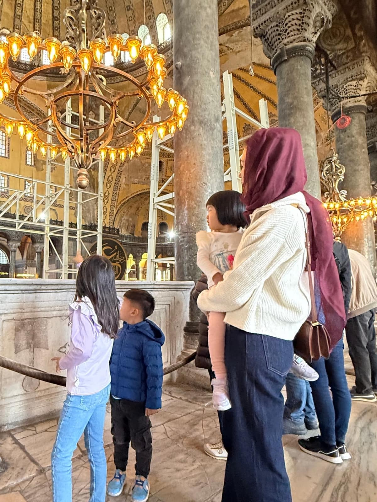 Vanessa and the children looking upward inside Hagia Sophia