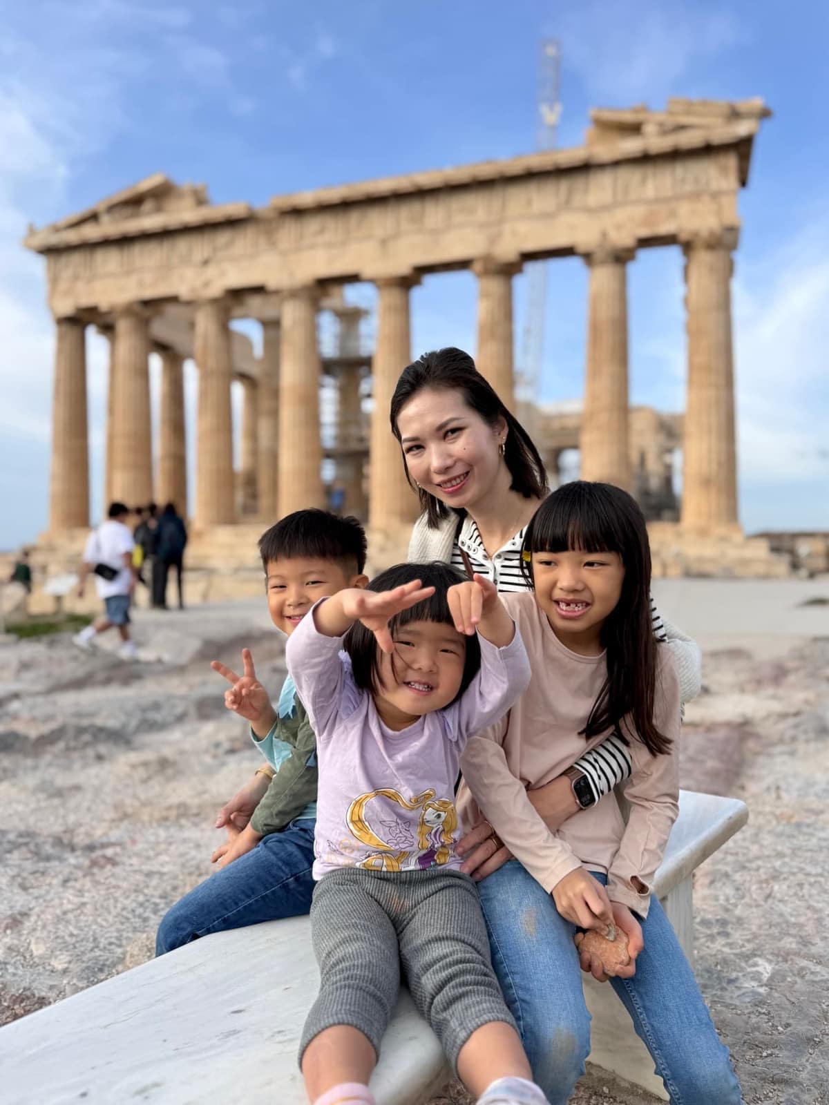 Vanessa and the three children together in front of the Parthenon