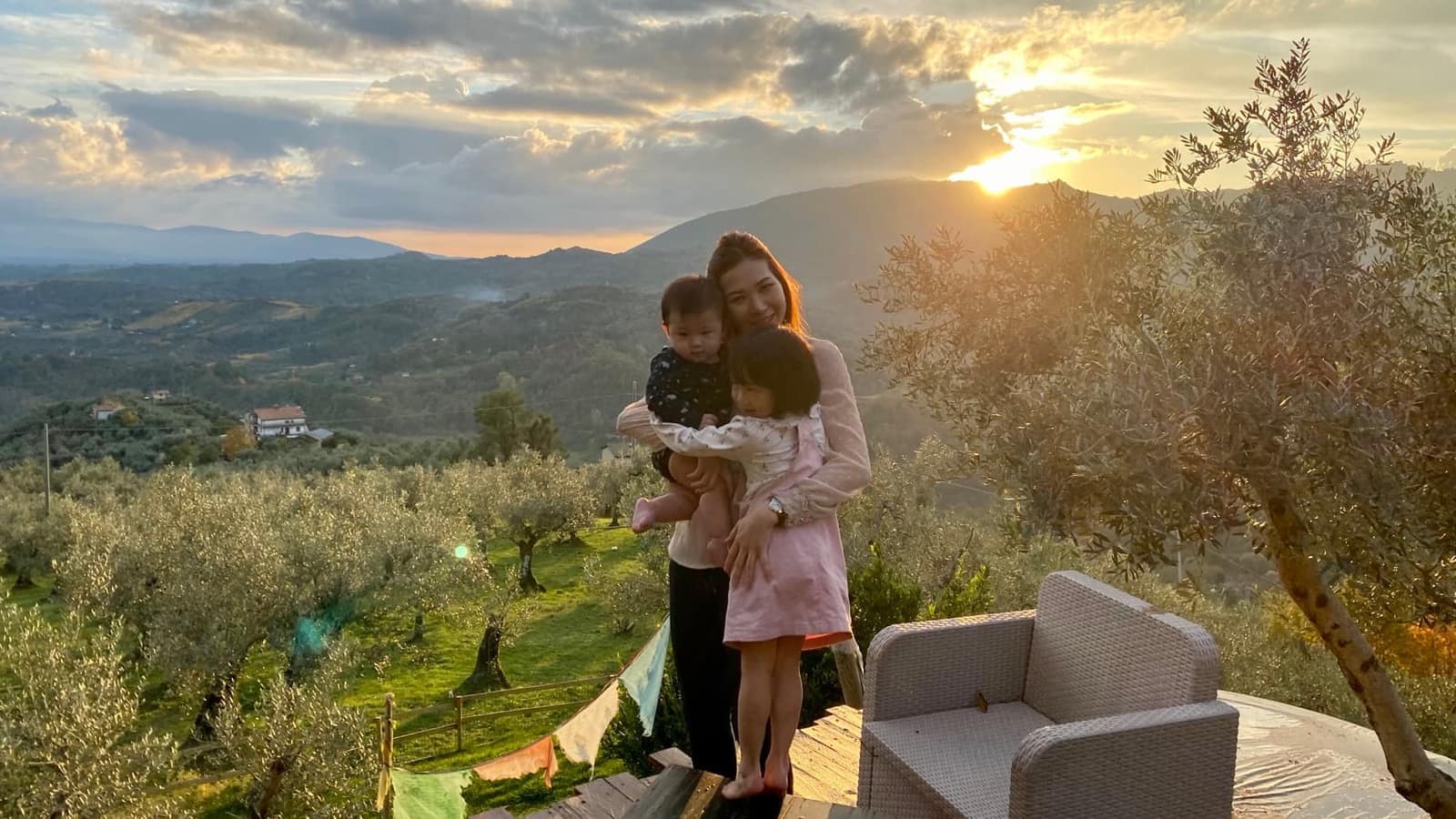 Vanessa, Sophie and George overlooking the hillside farm at sunset