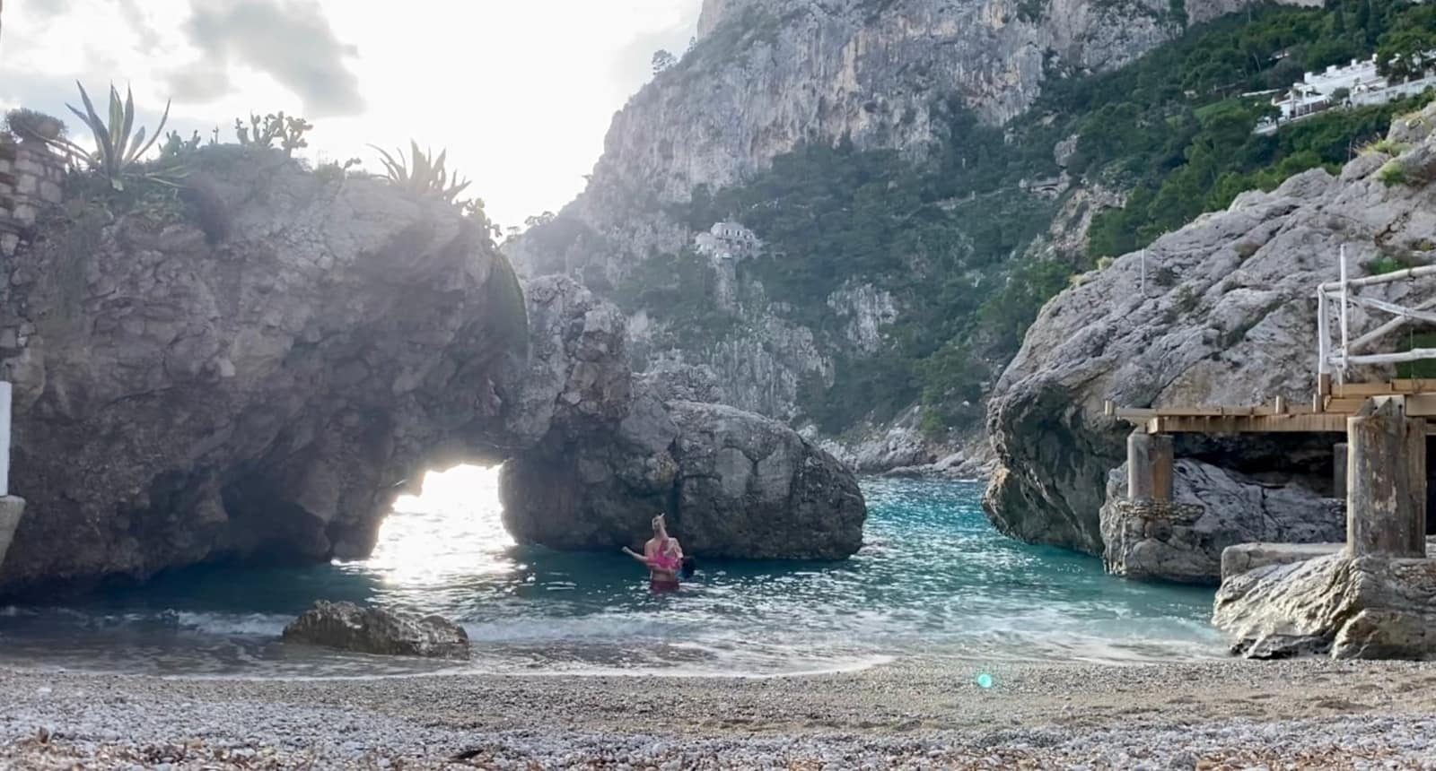 Philip and Sophie swimming at a rocky beach in Capri