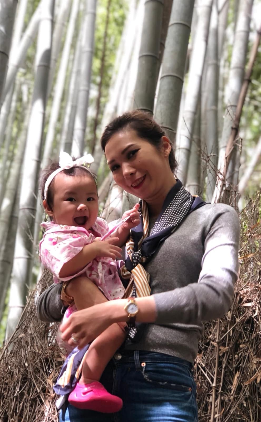 Vanessa holding Sophie among the bamboo at Arashiyama
