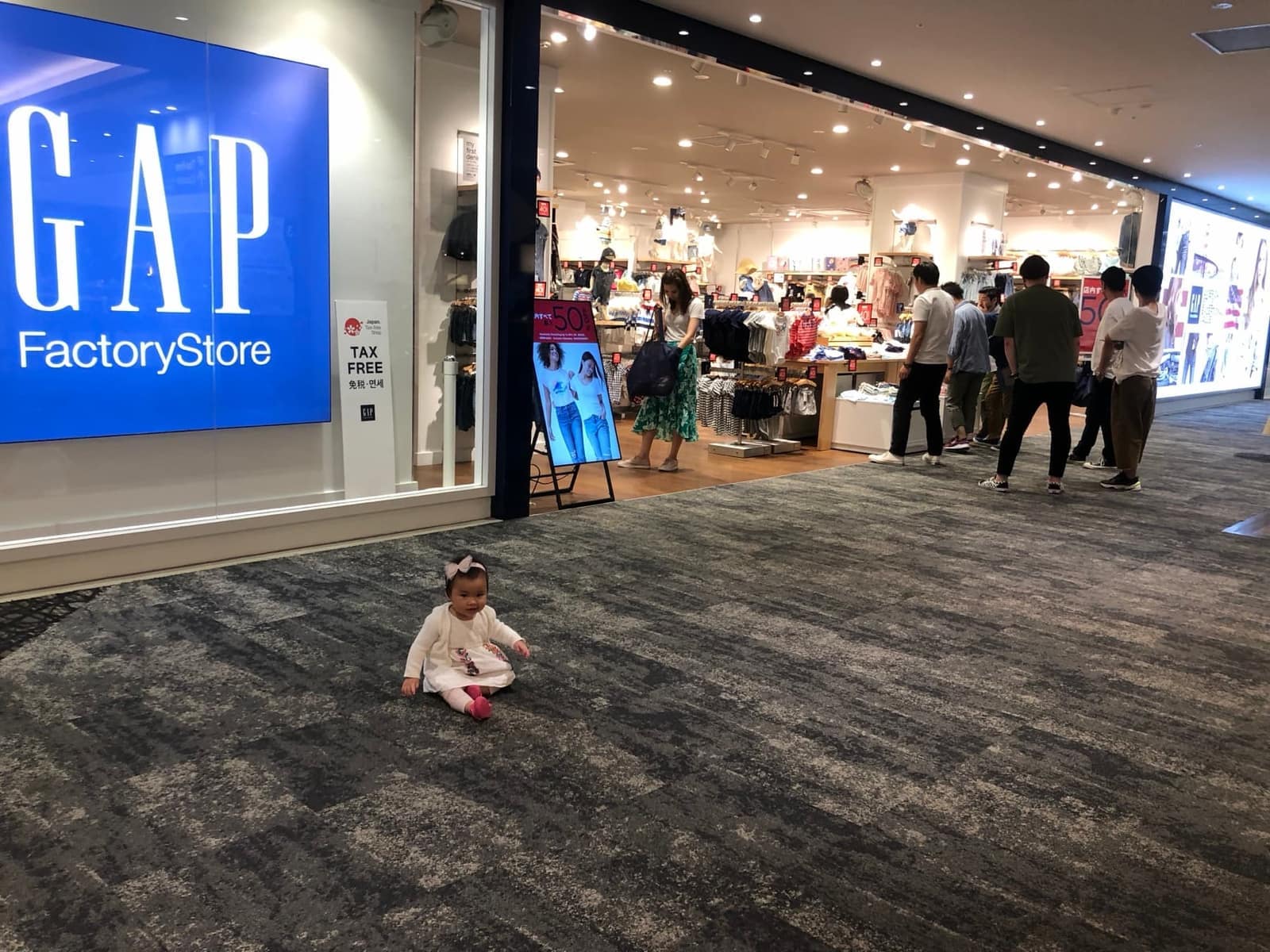 Sophie sitting on the floor at AEON Mall Kyoto
