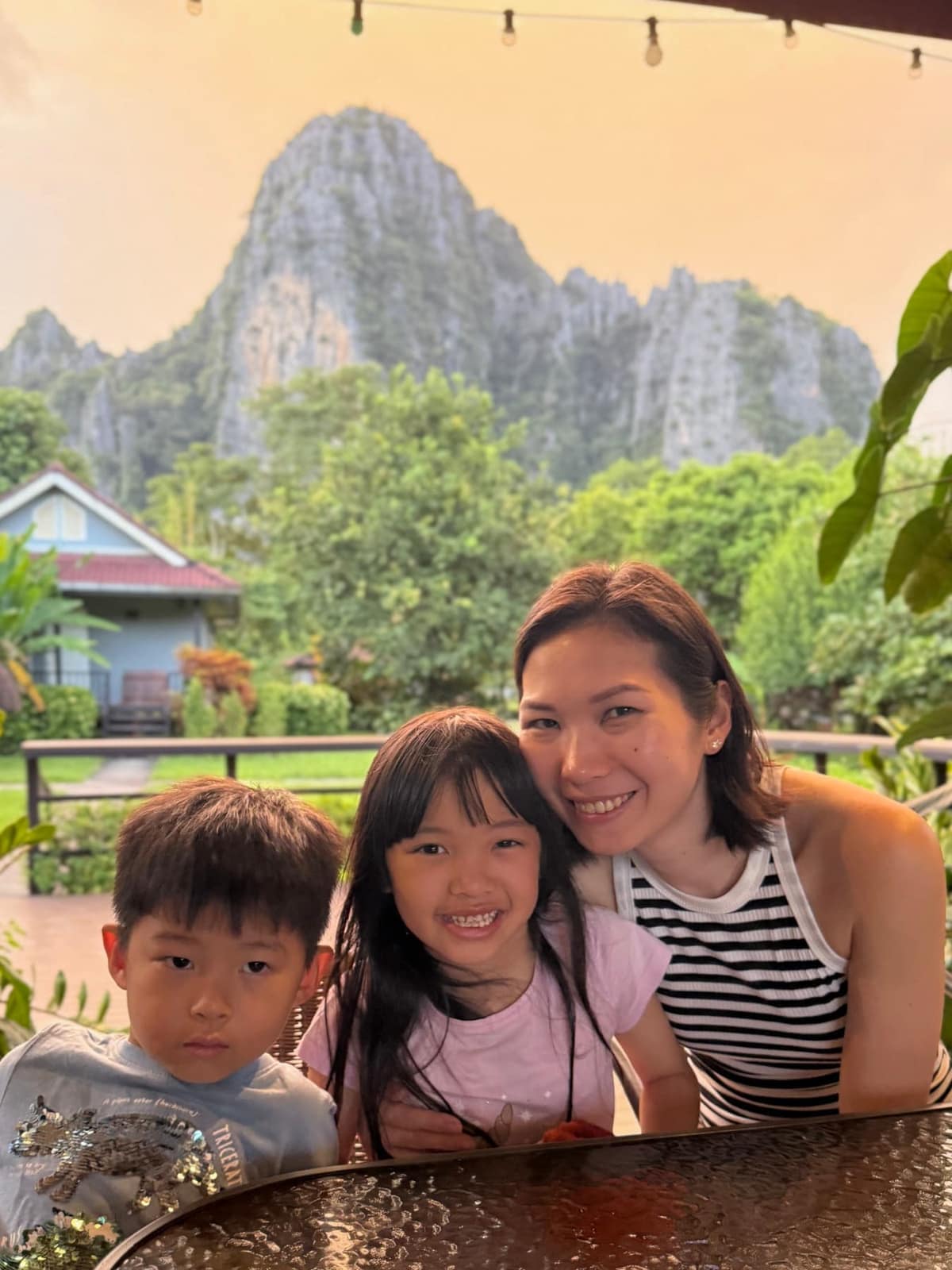 Vanessa, Sophie and George at Bearlin Bungalow with limestone hills behind them