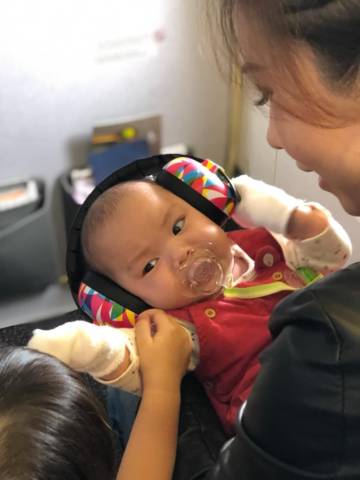 Vanessa holding baby Sophie during the flight