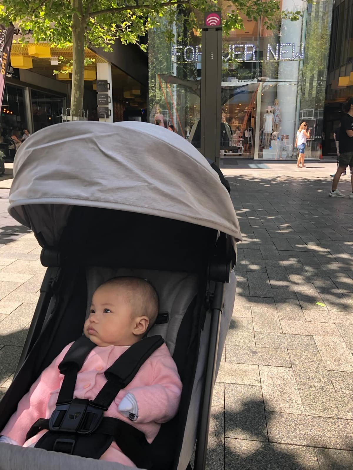 Sophie in a stroller on a Perth street