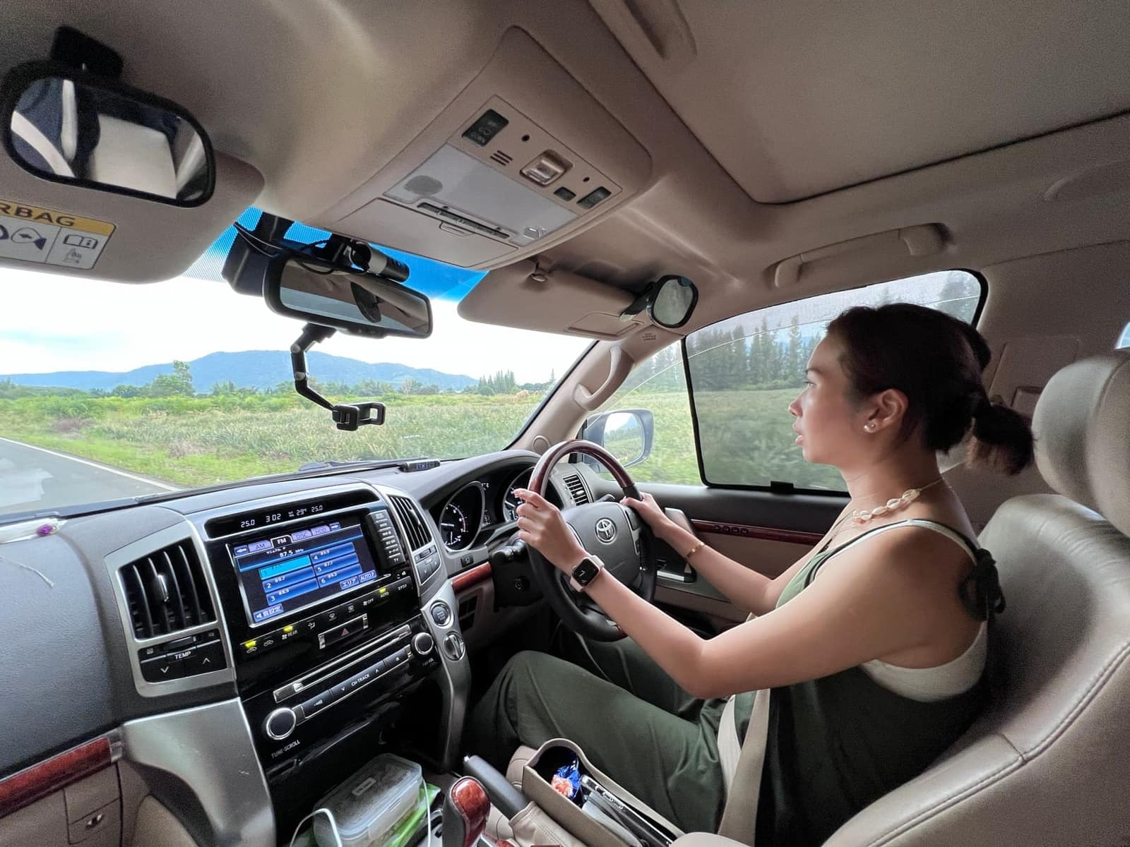 Philip driving the Land Cruiser along a rural Thai road