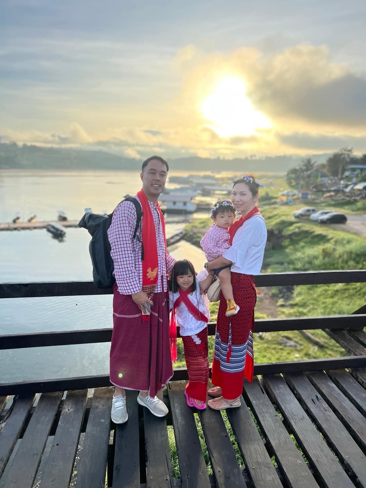 The family standing on Mon Bridge
