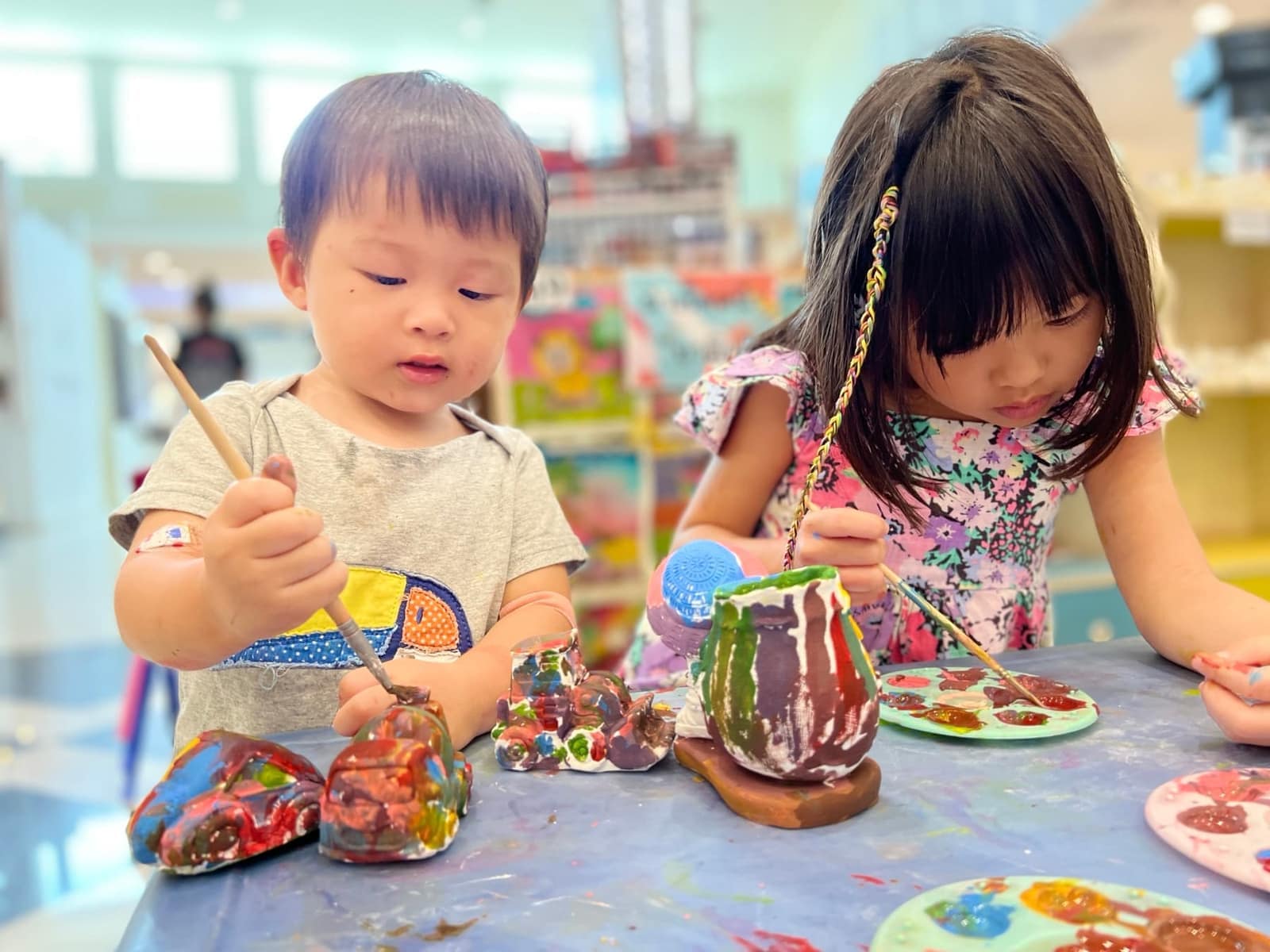 Sophie and George doing arts and crafts during a Hua Hin stop