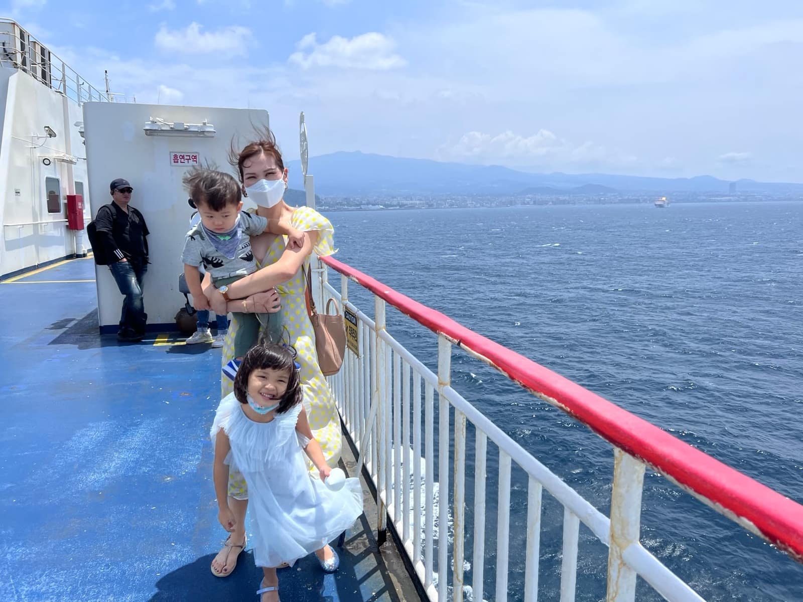Family on deck during the ferry crossing to Jeju