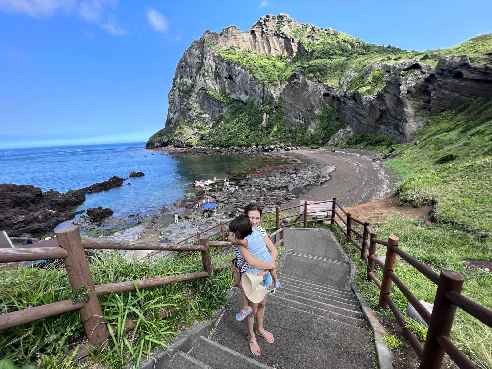 Family at a coastal viewpoint on Jeju