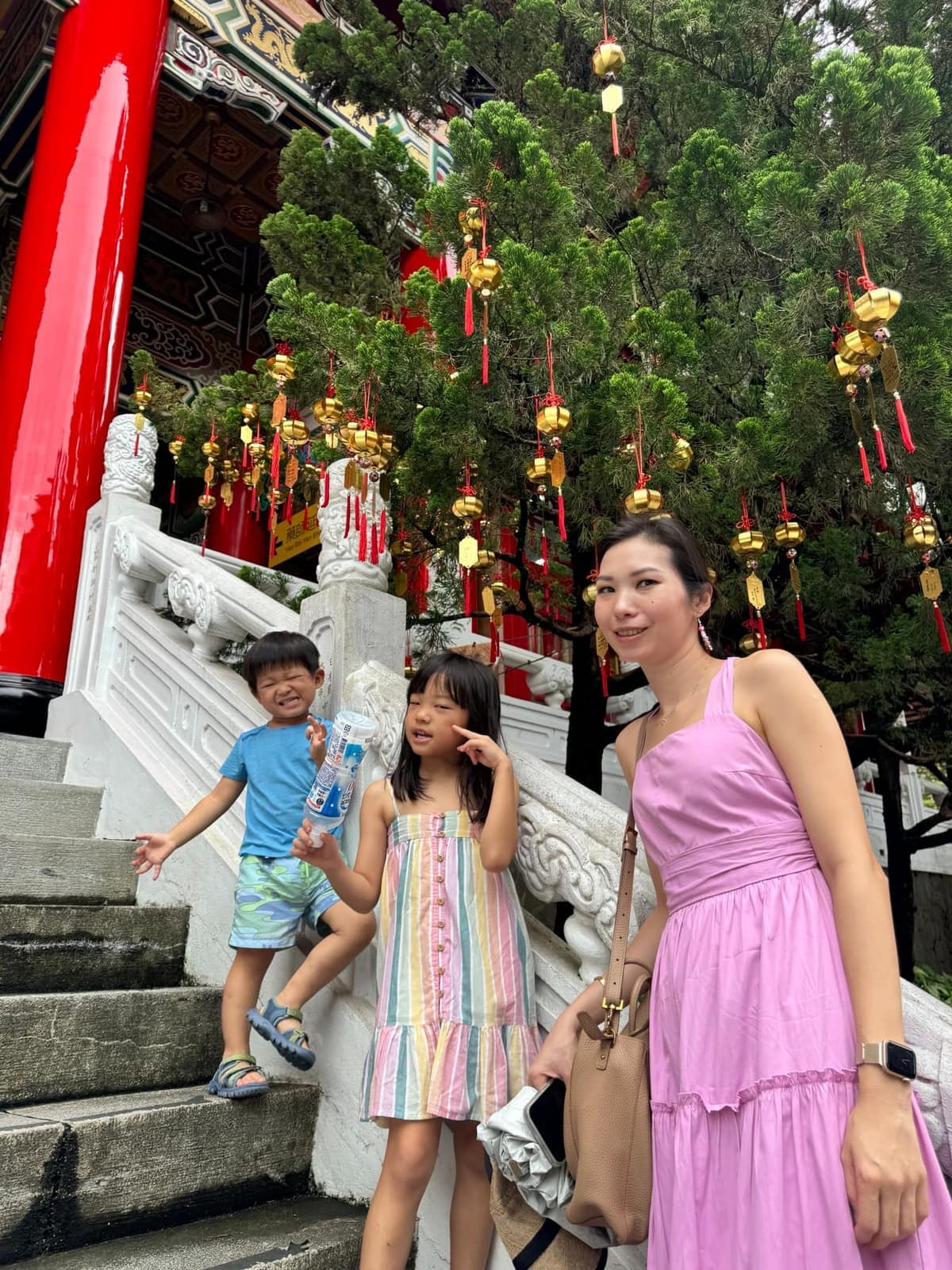 Vanessa and the children climbing temple steps at Sun Moon Lake