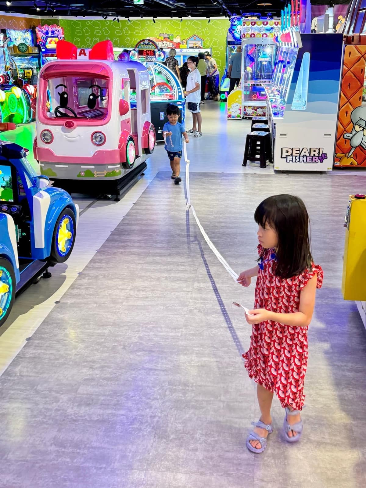 Sophie playing in an arcade on the final afternoon