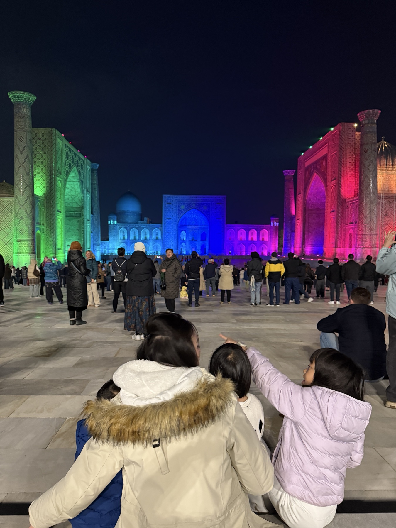 Family in Samarkand at night