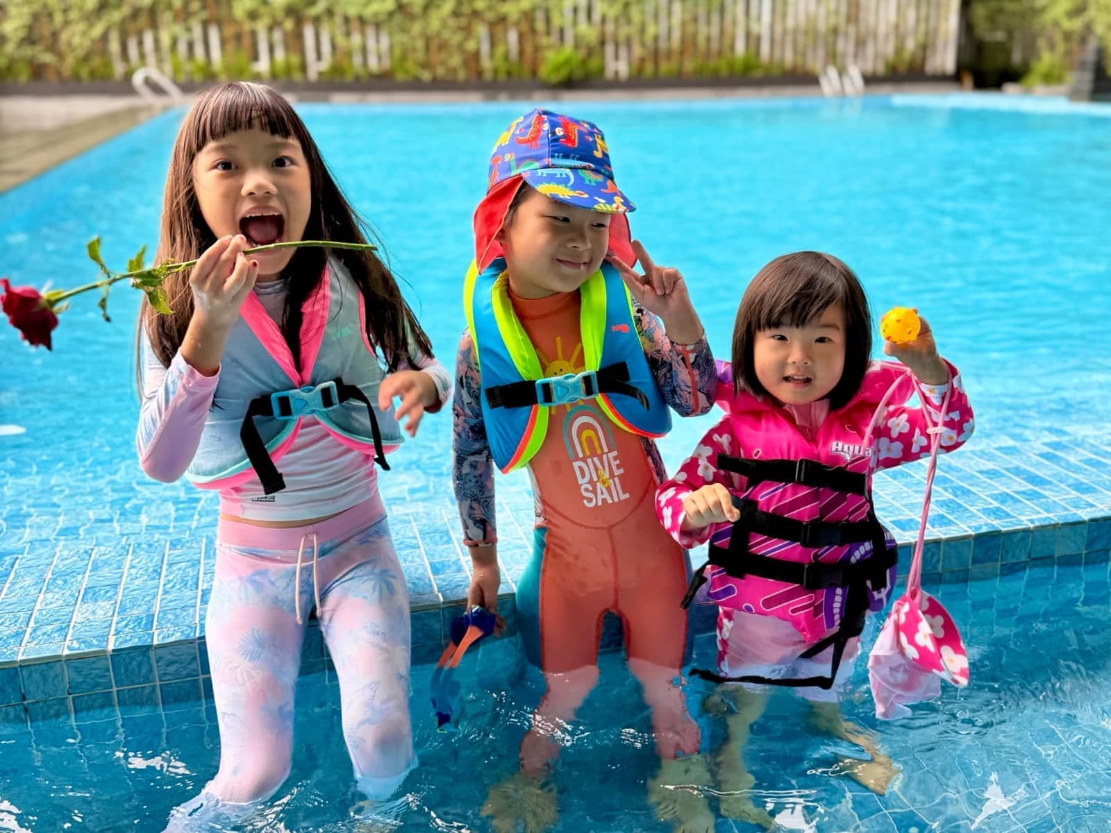 Sophie, George and Claire together in the hotel pool