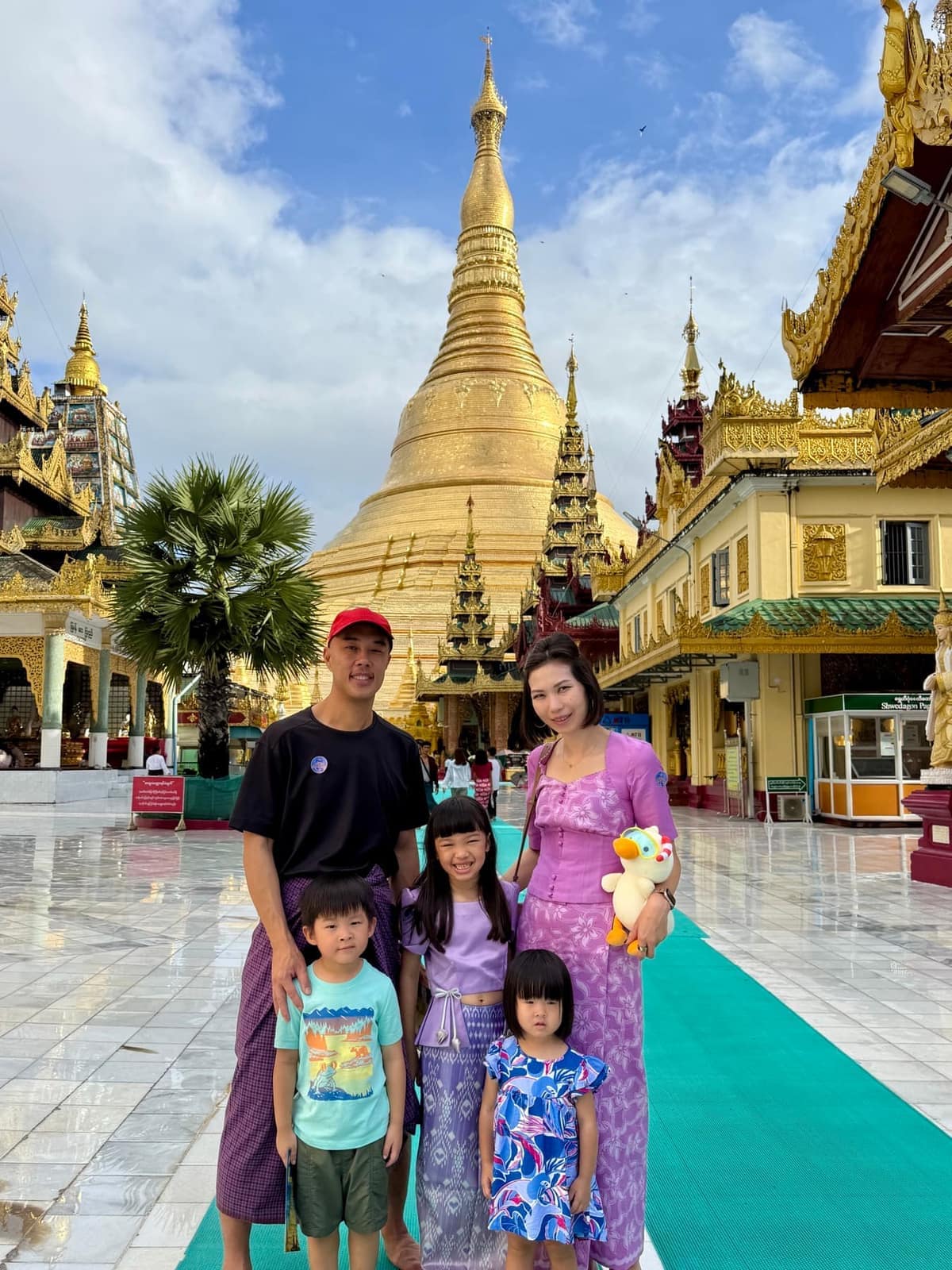 The Ngiau family standing together in front of Shwedagon Pagoda